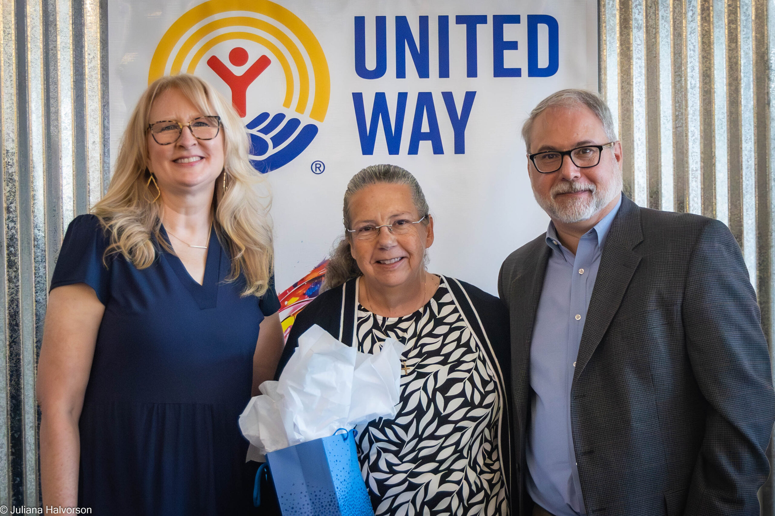 Nicole Austin, SVP/CLO, Leigh Humble, AVP/Internal Auditor, and Dough Austin, United Way Board President